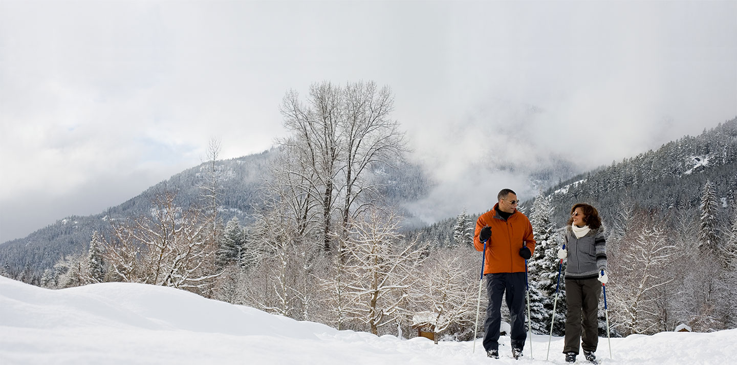 couple skiing in mountains