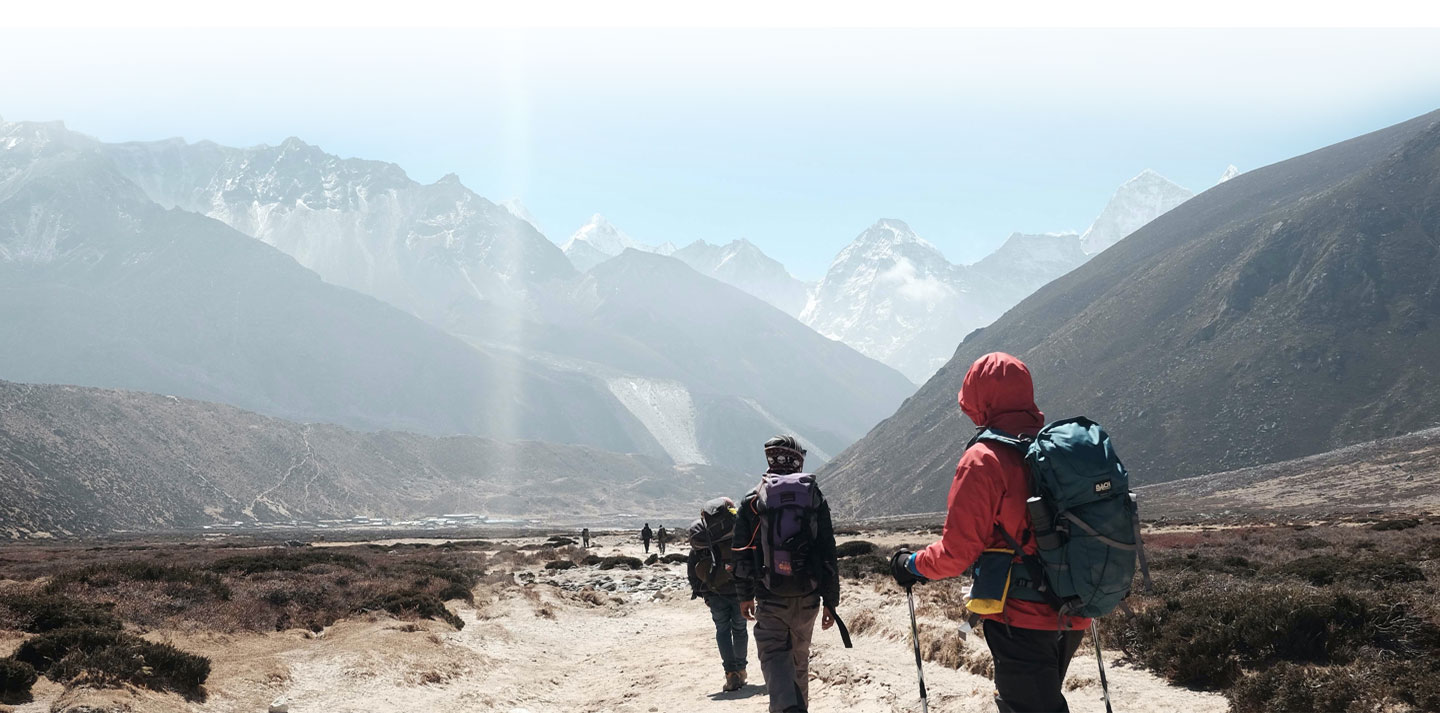 group of people hiking through mountains