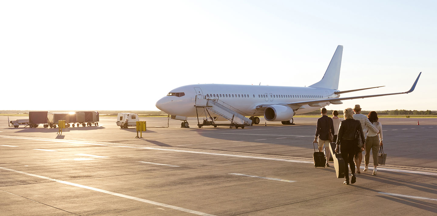 passengers walking towards airplane