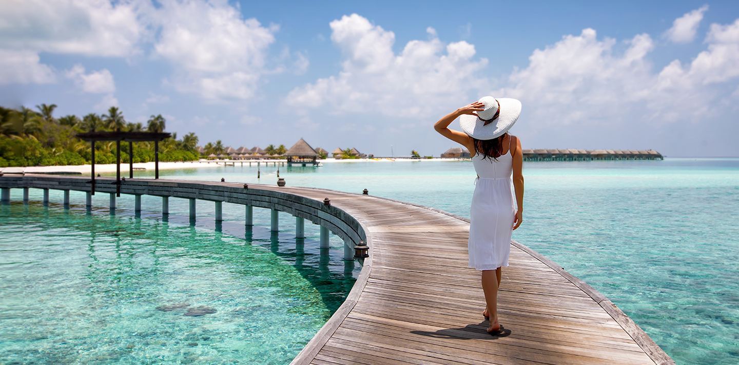 Woman walking on pier