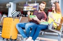 Couple eating food at airport gate