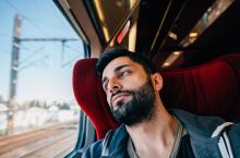 Anxious man traveling on train
