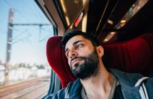 Anxious man traveling on train